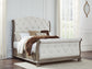Ardenfield Queen Upholstered Sleigh Bed with Mirrored Dresser and Nightstand